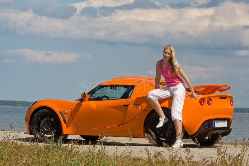 Young lady posing near a car