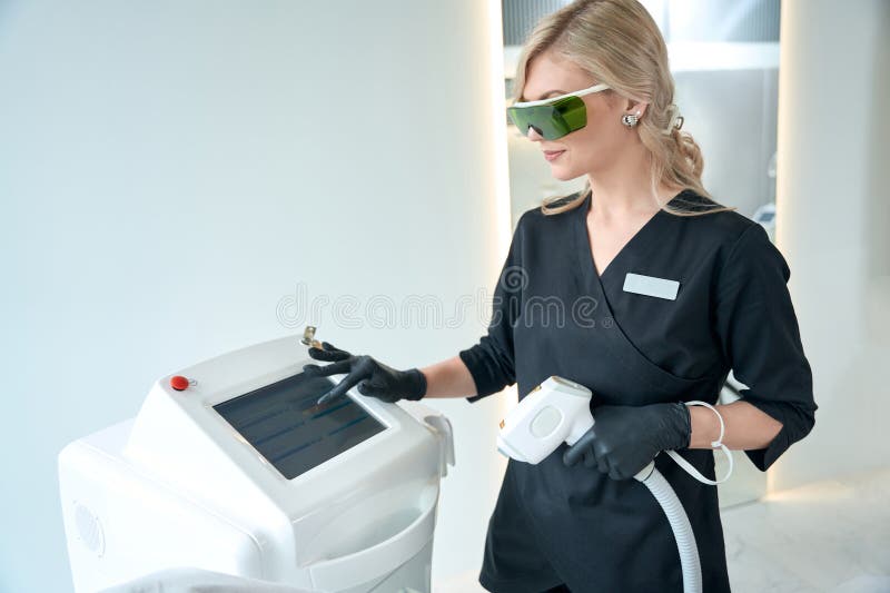 Young Lady Undergoing Laser Hair Removal Course for Body Stock Photo