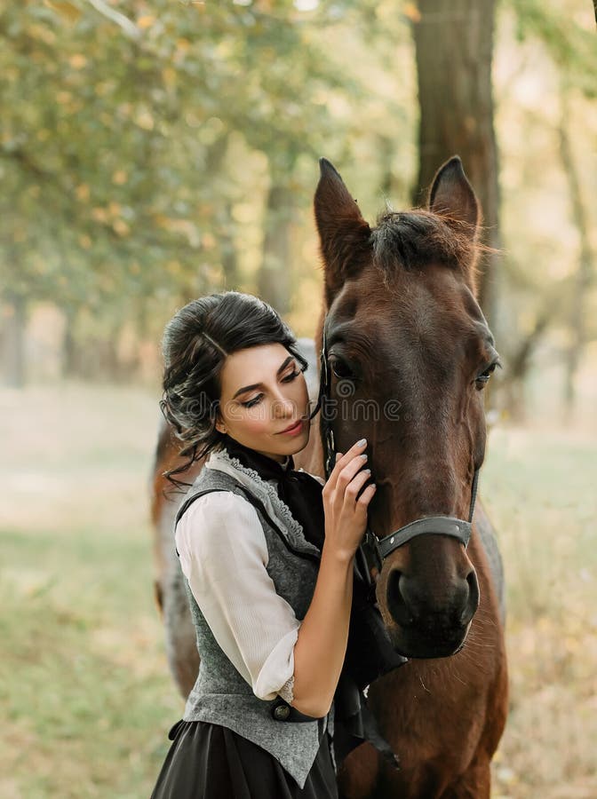 A Young Lady in a Vintage Dress, with Tenderness and with Affection Hugs  Her Horse. an Ancient, Collected Hairstyle, a Gentle Make Stock Photo -  Image of horseback, mysterious: 127589658
