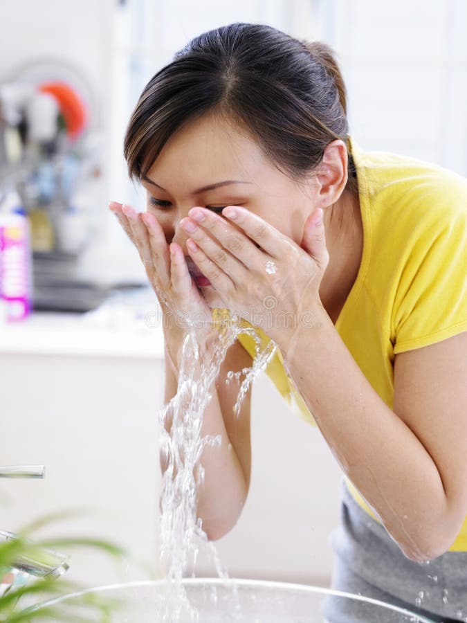 A Young Lady Washing Her Face Stock Image Image of clean, chinese