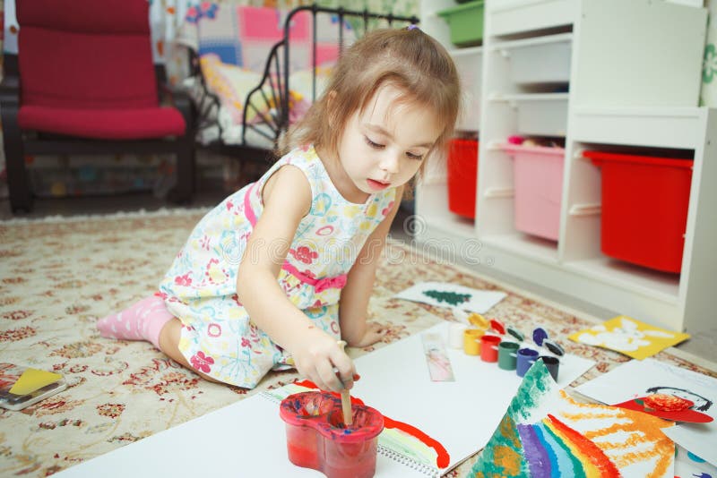 Young lady wearing dress and drawing picture with gouache royalty free stock photos Young lady wearing dress and drawing picture with gouache royalty free stock photos