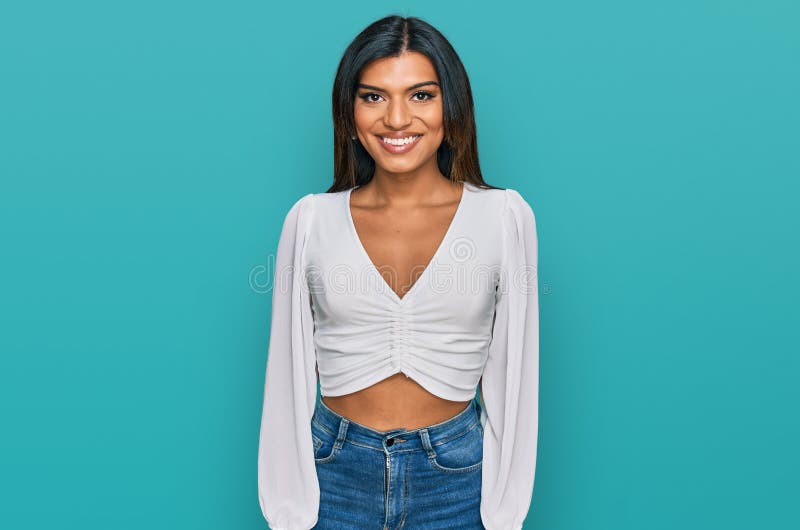 Young latin transsexual transgender woman wearing casual clothes with a happy and cool smile on face