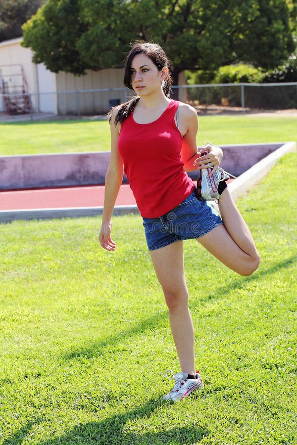 Young Latina Teen Girl Stretching on Green Grass Stock Photo - Image of  shorts, grass: 15490848