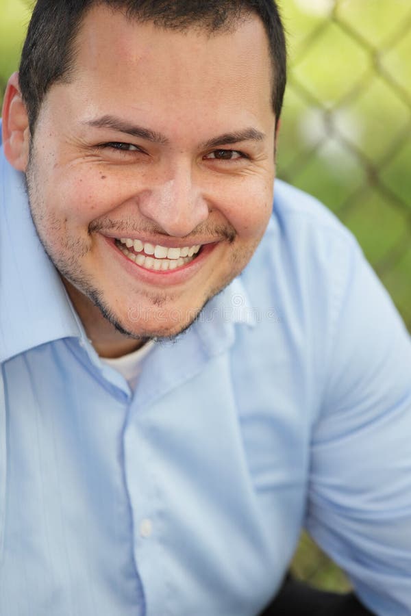 Young Latino man smiling