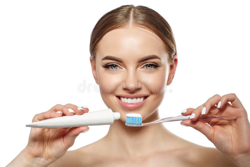 Young laughing woman with great stunning snow-white teeth. Girl with a healthy smile with a brush, toothpaste and floss