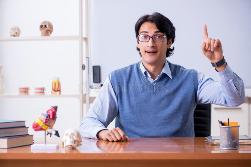The young lecturer teacher teaching anatomy royalty free stock photo The young lecturer teacher teaching anatomy royalty free stock photo