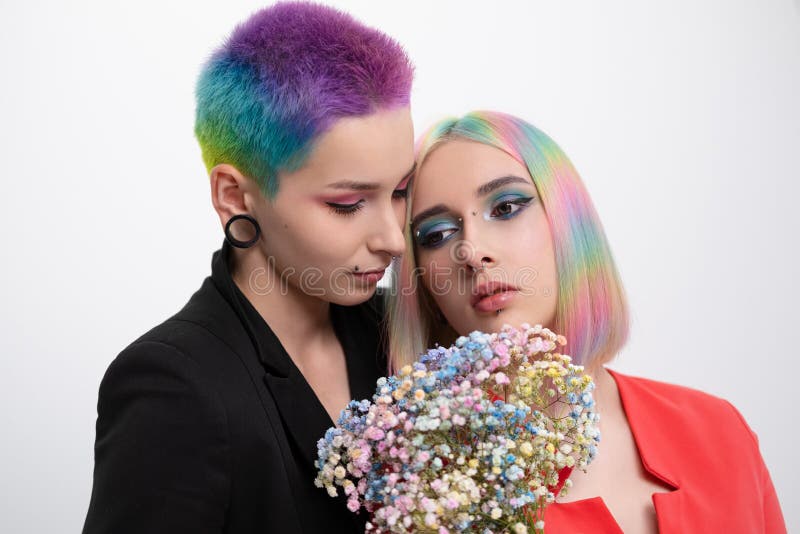 Young Lesbian Woman Couple With Vivd Colored Short Hair And Jackets