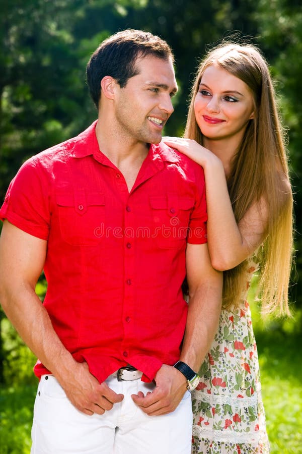 Young love couple smiling outdoors