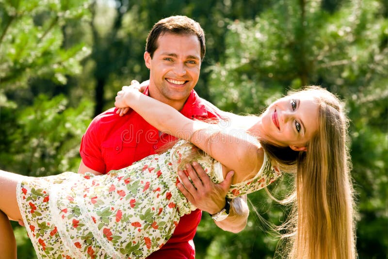 Young love couple smiling outdoors