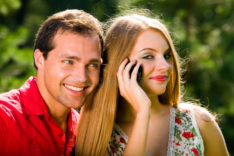 Young love couple smiling outdoors