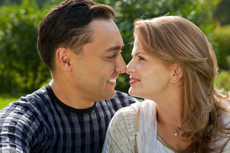 Young loving couple face to face outdoors royalty free stock images Young loving couple face to face outdoors royalty free stock images