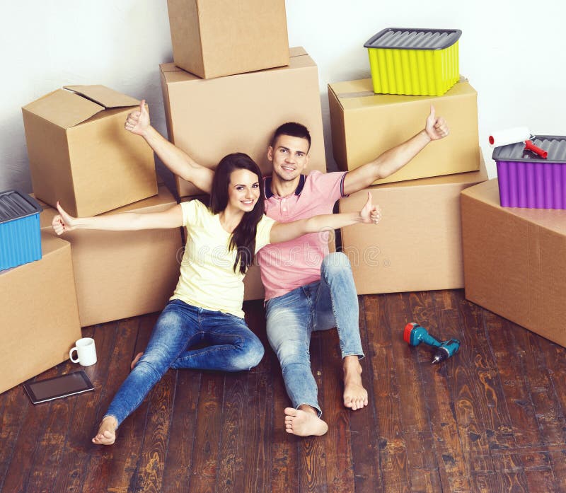 Young loving couple moving to a new house. Home and family concept.