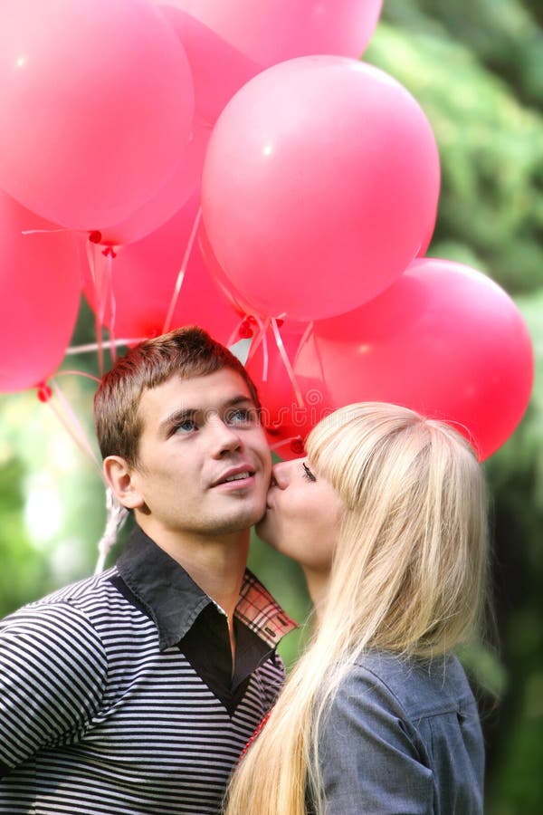 Young loving couple on natural background