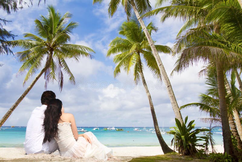 Young loving couple on tropical sea background