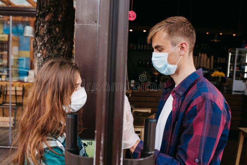 Young Scared Couple Hugging Wearing A Face Protection Mask In The City ...