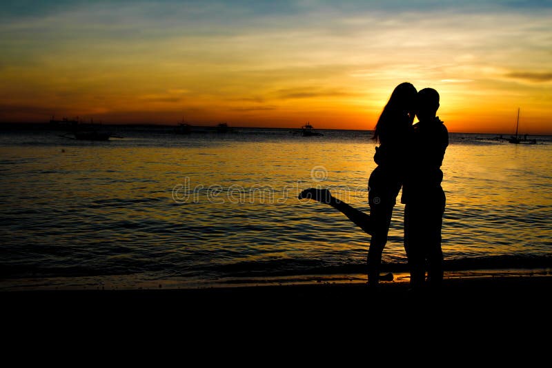 Young loving couple on wedding day on tropical beach and sunset