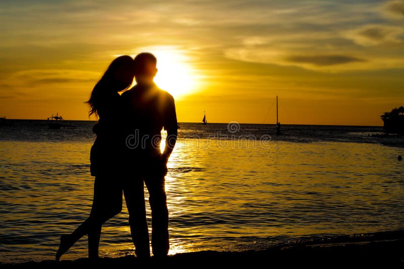 Young loving couple on wedding day on tropical beach and sunset