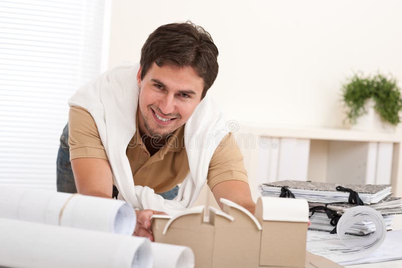 Young male architect working at office stock images
