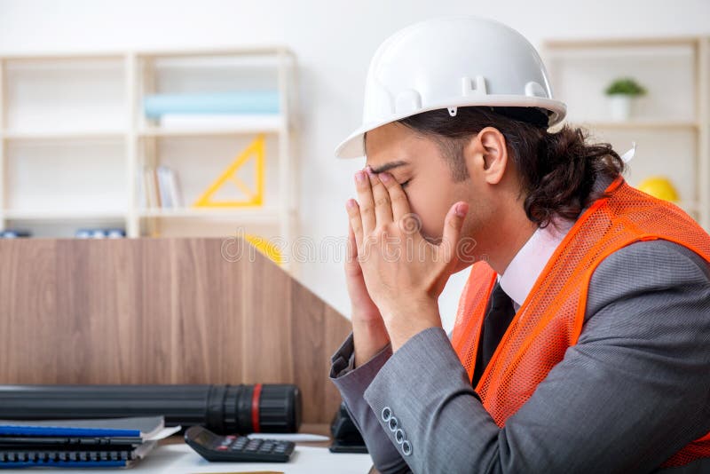 Young male architect working in the office royalty free stock photos Young male architect working in the office royalty free stock photos