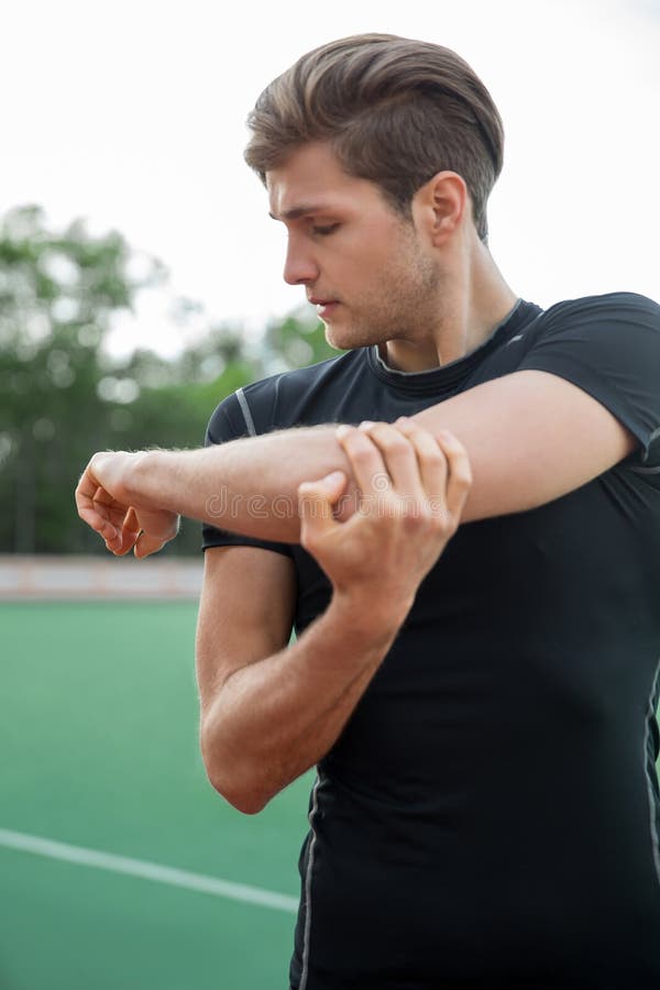 Young male athlete make stretching exercises outdoors royalty free stock images