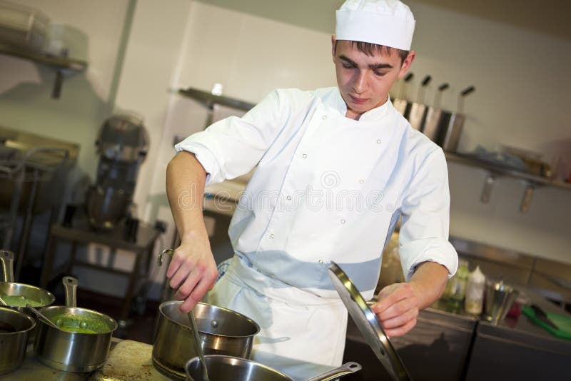 Young male chef cooking meal