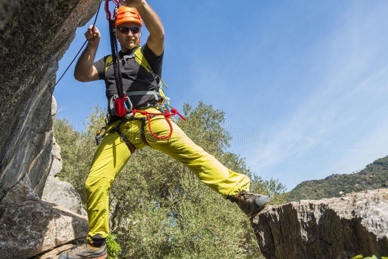Young male climbing a via ferrata stock photos Young male climbing a via ferrata stock photos