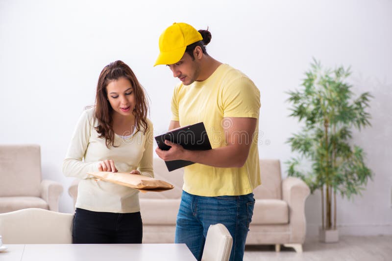 Young Male Courier Delivering Parcel To The Office Stock Image Image of present, confirmation