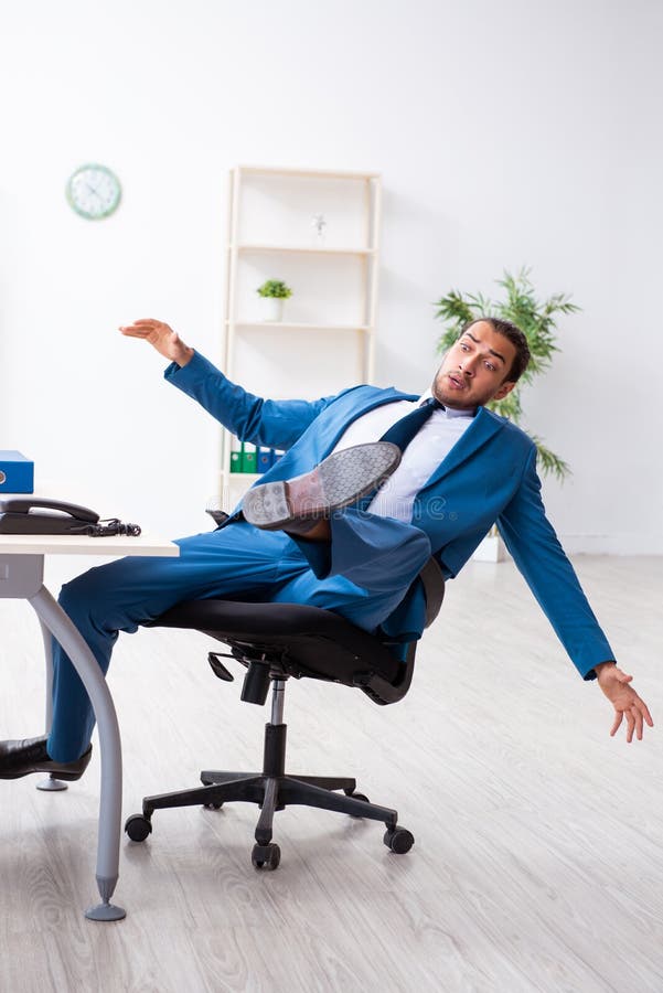 Young Male Employee in Work Accident Concept Stock Photo Image of