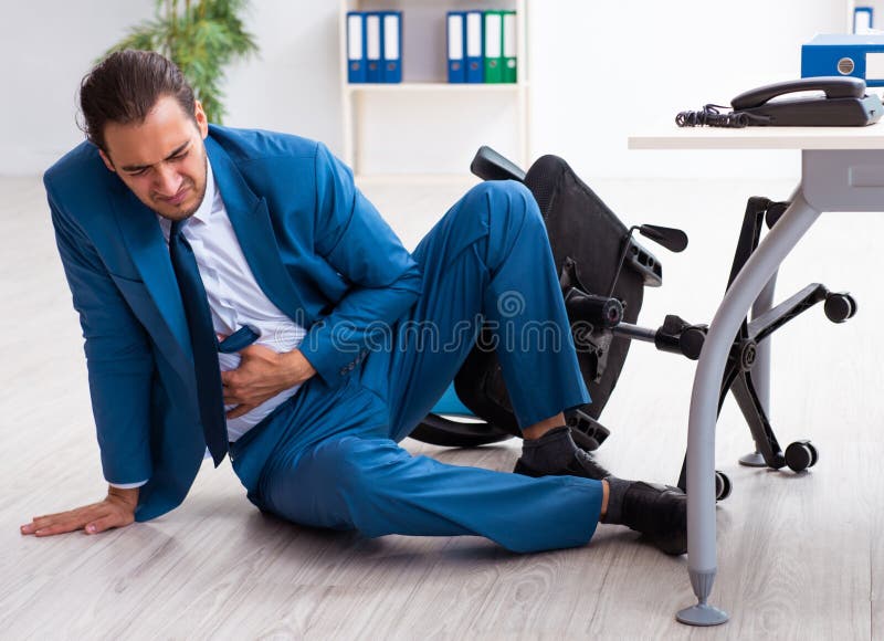 Young male employee in work accident concept royalty free stock photography