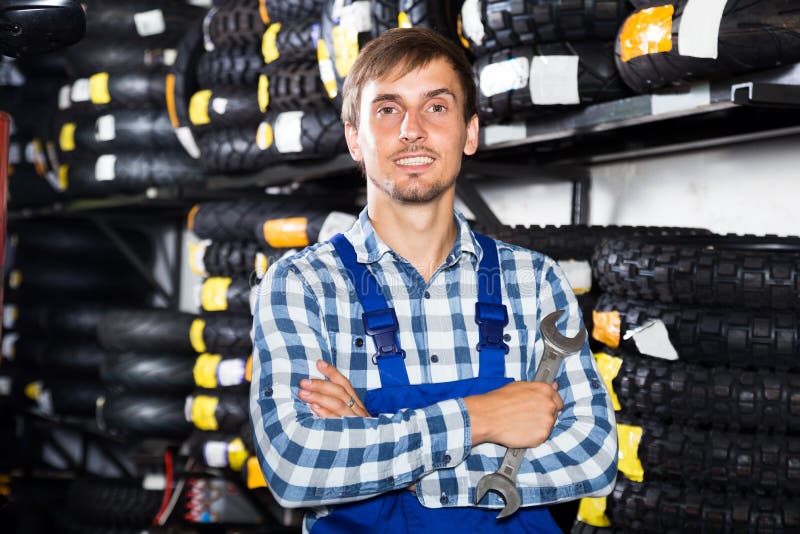 Young male mechanic working in auto repair shop royalty free stock photos Young male mechanic working in auto repair shop royalty free stock photos