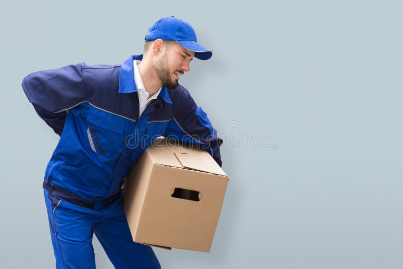 Mover Suffering From Backache While Carrying Parcel stock photos Mover Suffering From Backache While Carrying Parcel stock photos