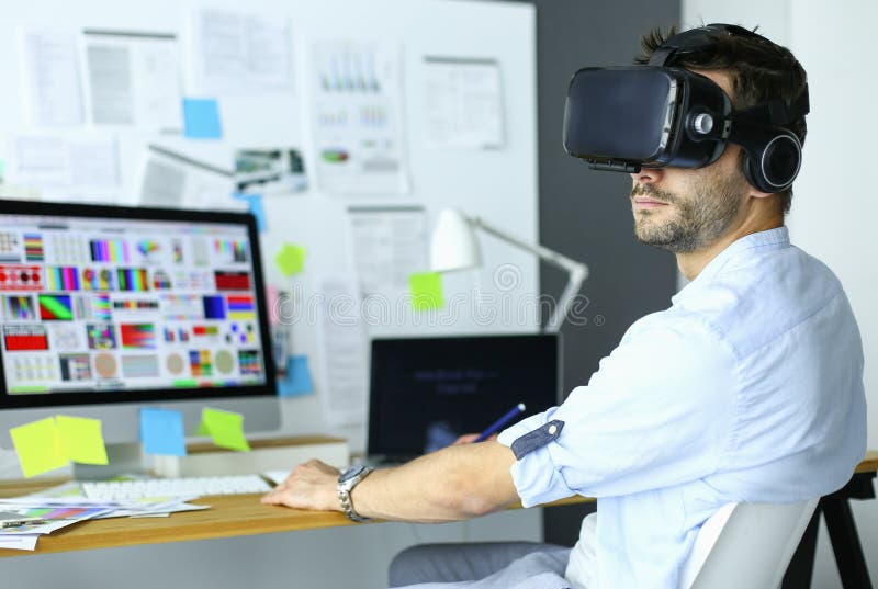 Young Male Software Programmer Testing A New App With 3d Virtual Reality Glasses In Office