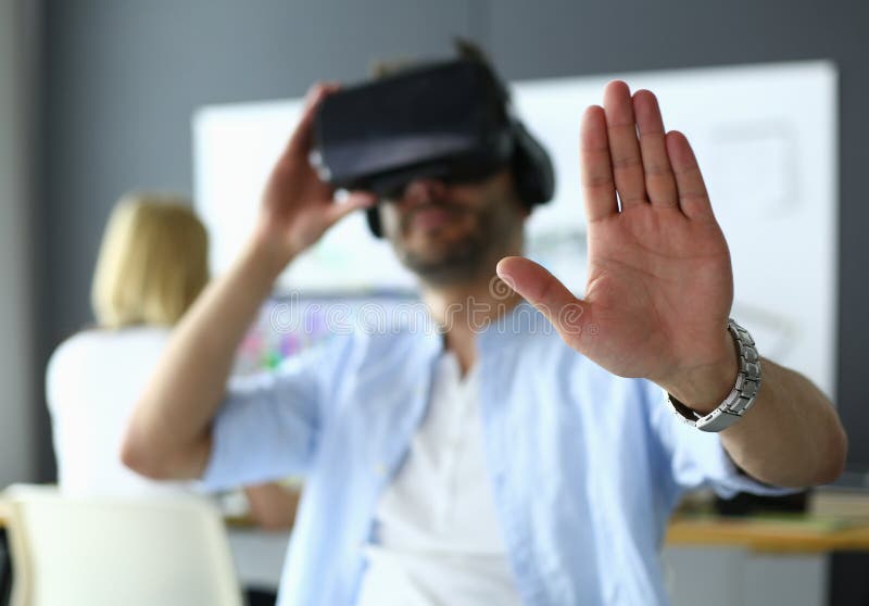 Young Male Software Programmer Testing A New App With 3d Virtual