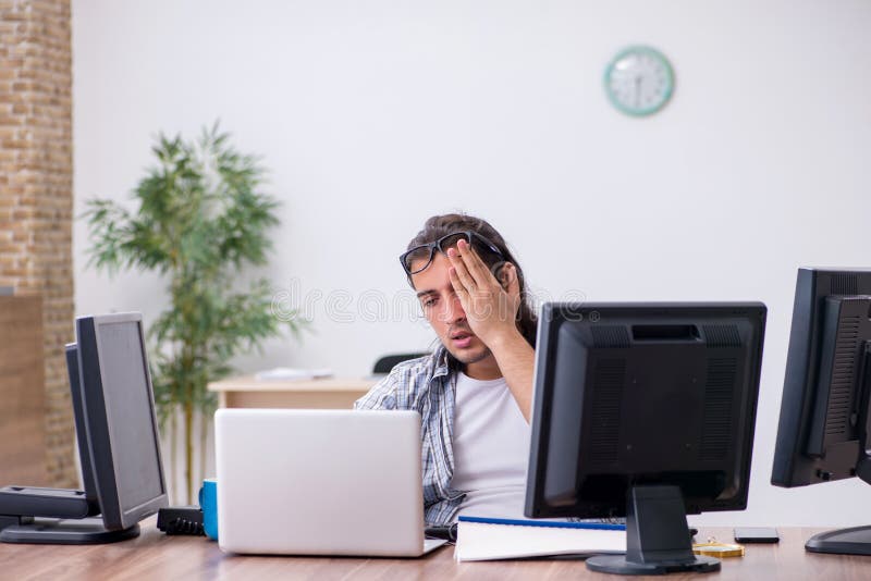 Young male it specialist working in the office stock image