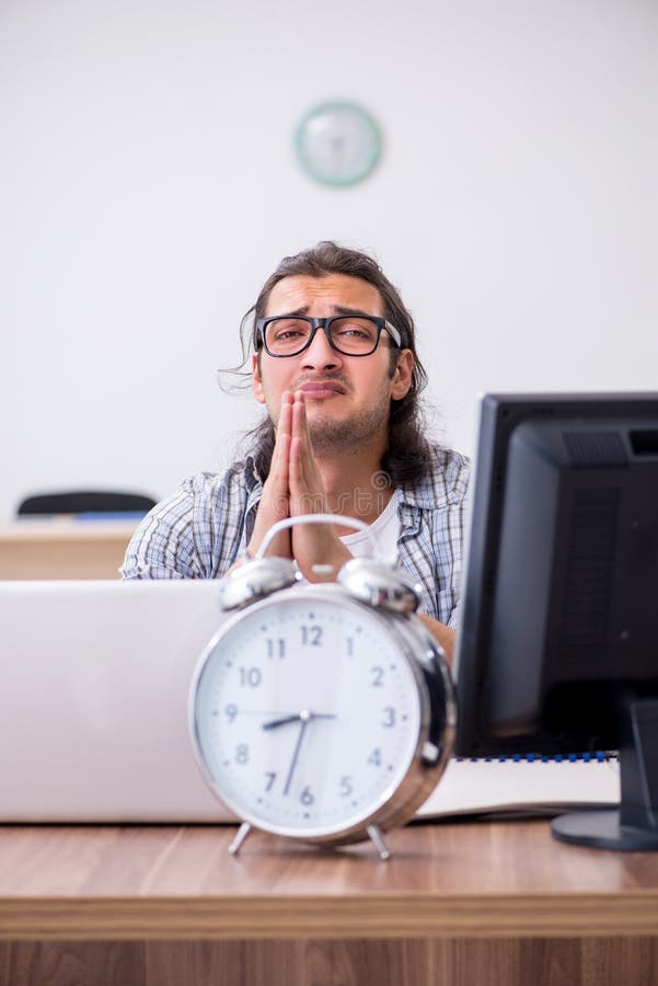 Young male it specialist working in the office royalty free stock photography