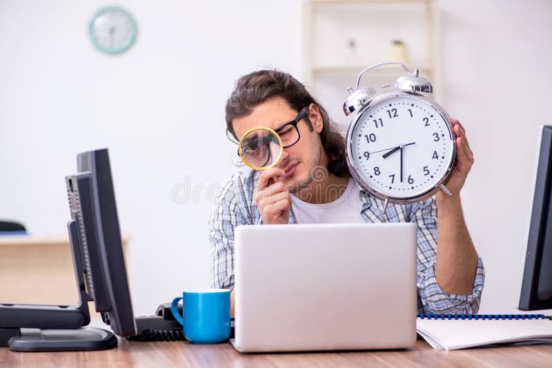 Young male it specialist working in the office royalty free stock photo