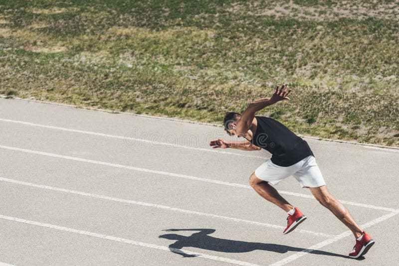 Young Male Sprinter Taking Off from Starting Position Stock Image ...