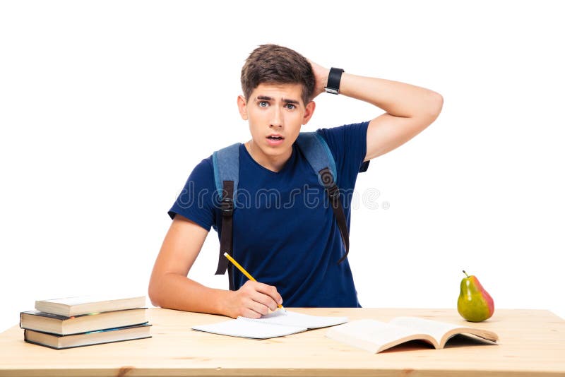 Young male student sitting at the table stock photography