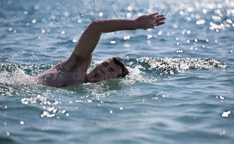 Young male swimmer swimming in the sea/ocean