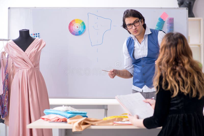 Tailor is teaching student stock image. Image of repair - 165278399