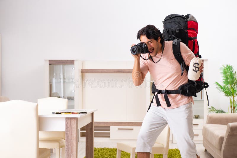 The Young Male Tourist Preparing for Trip at Home Stock Image - Image ...