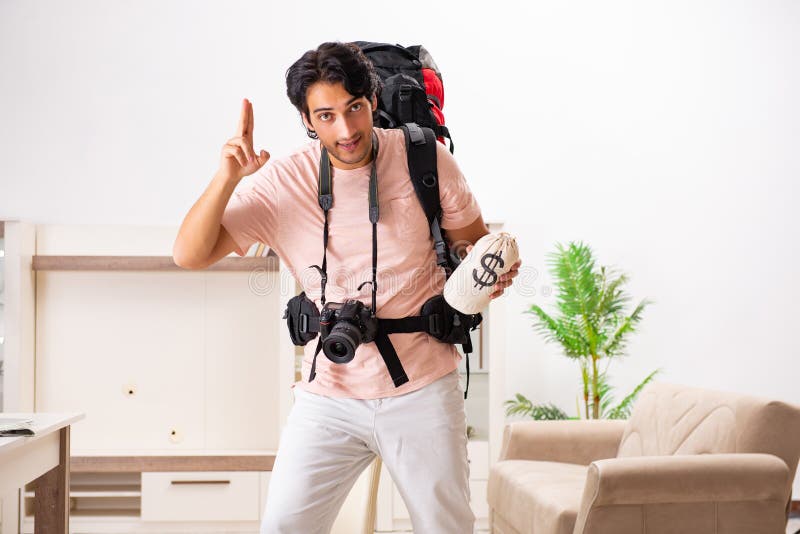 The Young Male Tourist Preparing for Trip at Home Stock Photo - Image ...