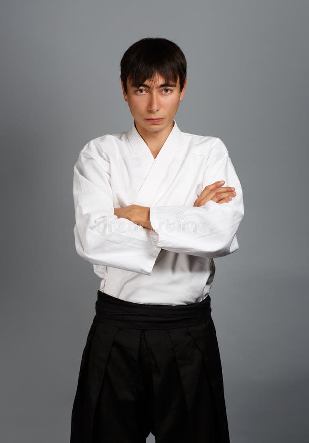 Sorprendido eso es todo Ruina Man in Aikido Uniform with Katana Sword Stock Photo - Image of attitude,  background: 35719738