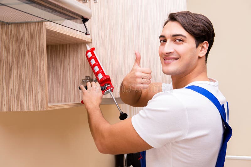 The Young Man Assembling Kitchen Furniture Stock Image Image of assembly, maintenance 89619101