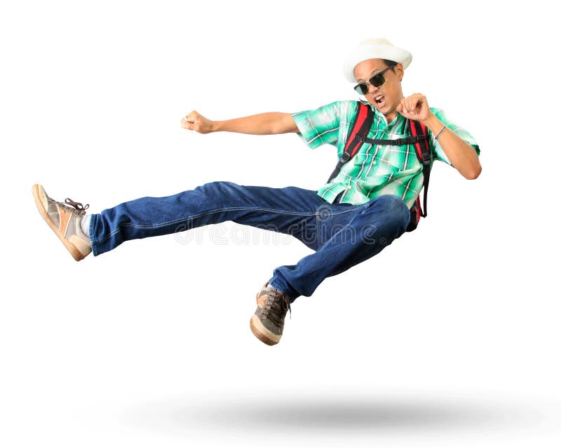 Young man with back pack sky kick jumping action isolated white royalty free stock photography Young man with back pack sky kick jumping action isolated white royalty free stock photography