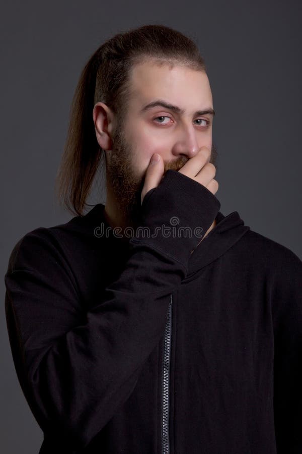 Young Man with a Beard Covers Her Mouth Stock Photo Image of young