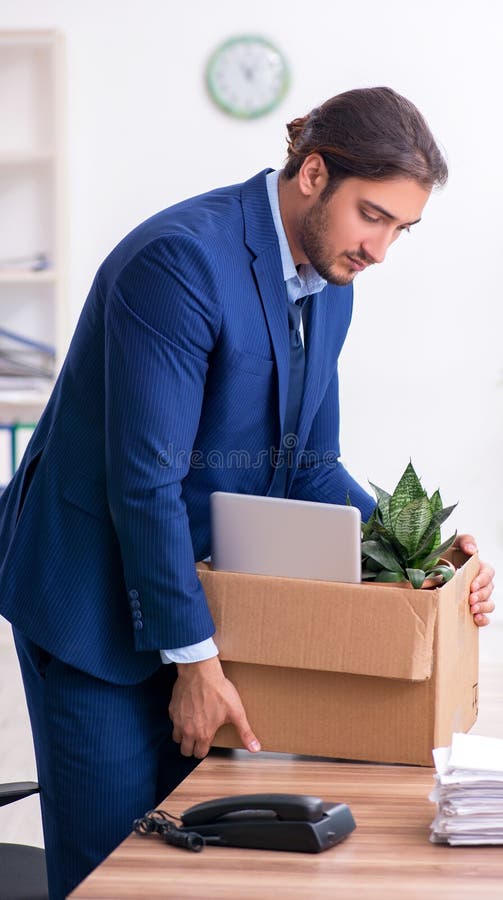 Young man being fired from his work royalty free stock photography