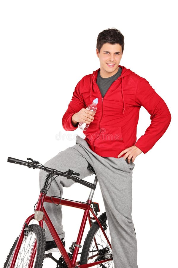 On A Bike Holding Water Bottle On A Bike Holding Water Bottle Stock Photo