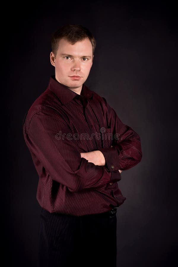 Young man on a black background