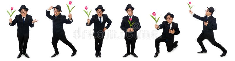 The young man in black costume with flower isolated on white